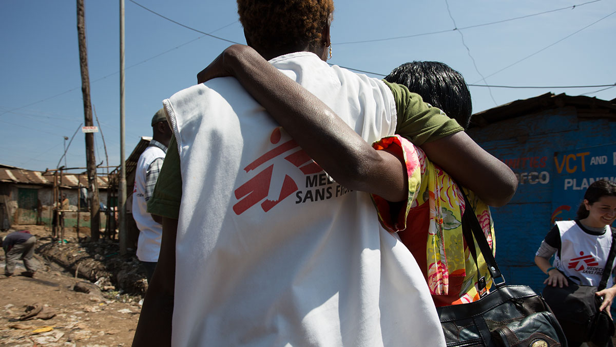 A member of the community hugs a member of MSF staff in Nairobi, Kenya